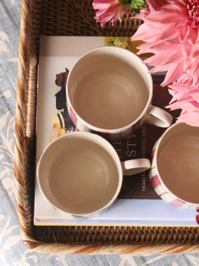 Ceramic mugs handmade with a thin rim and pulled handles