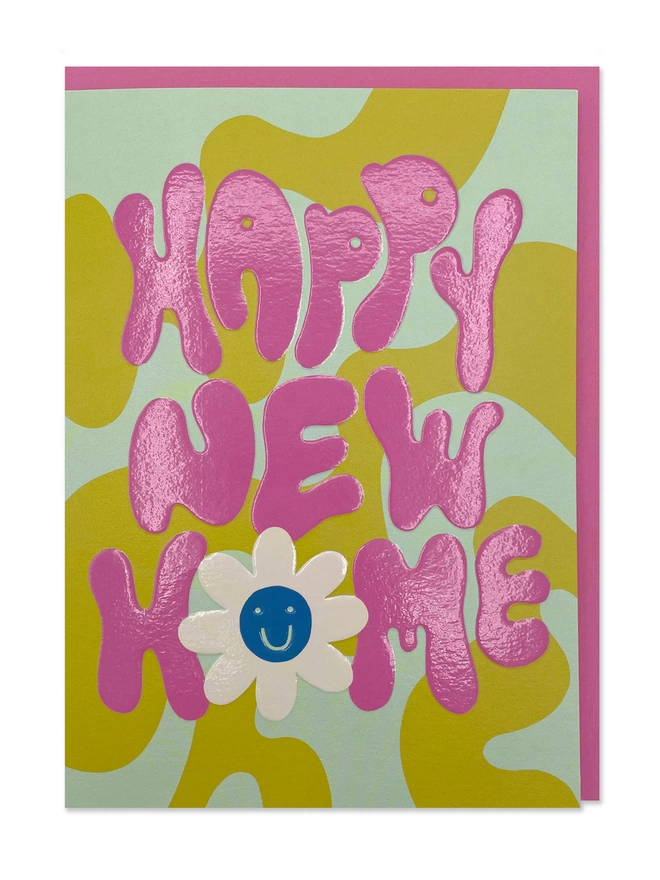 A colourful new home card with ‘Happy New Home’ message in chunky 70’s inspired hand lettering, and a zingy colour palette of pink, green and mint