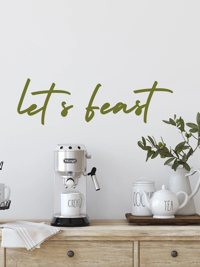 ;ets feast wall sticker in green above a tea and coffee station