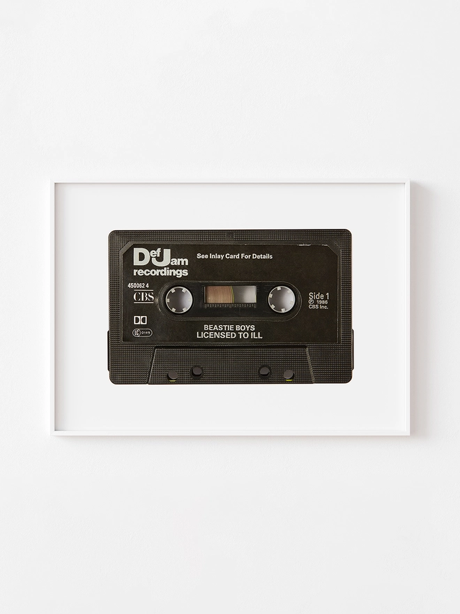 beastie boys license to iii cassette tape print. print framed against white wall.