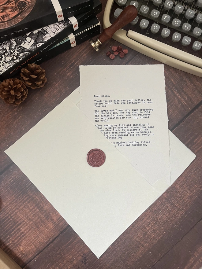 letter to santa, hand typed onto handmade cotton rag paper using an antique typewriter with a merry christmas red wax seal and envelope. 