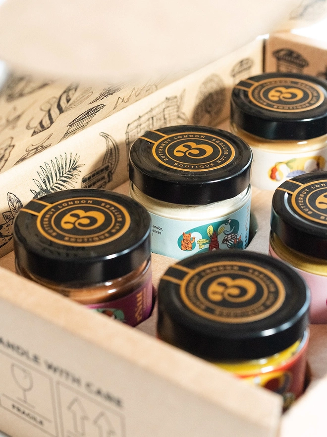 jars of butternut of london nut butters, sitting in a nicely designed cardboard gift box