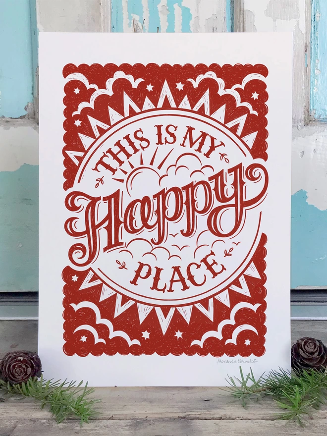 red happy place print in front of blue cabin door