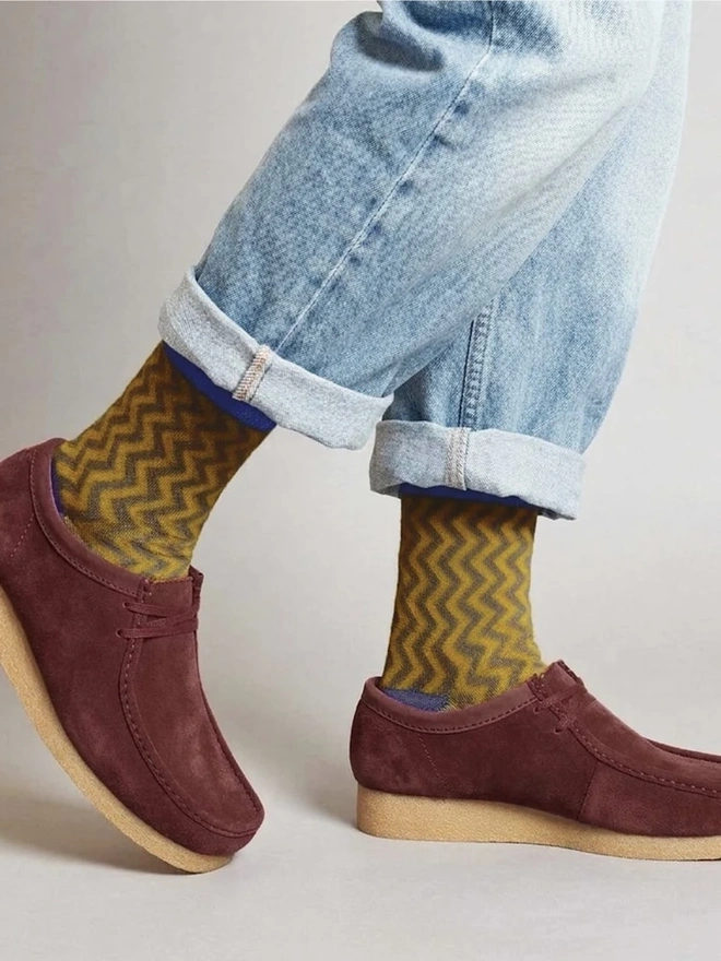 Men's Organic Cotton Ankle Socks Packs (Sets Of 3), a man wearing a pair of colourful patterned socks. 
