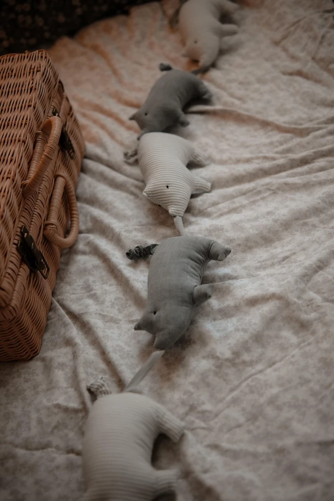 Pig Garland Decoration, a grey and white pig garland decoration in a child's bedroom. It is accompanied by other bedroom accessories. 