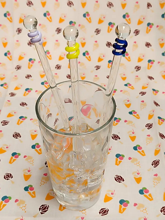 Group of three glass drinks stirrers