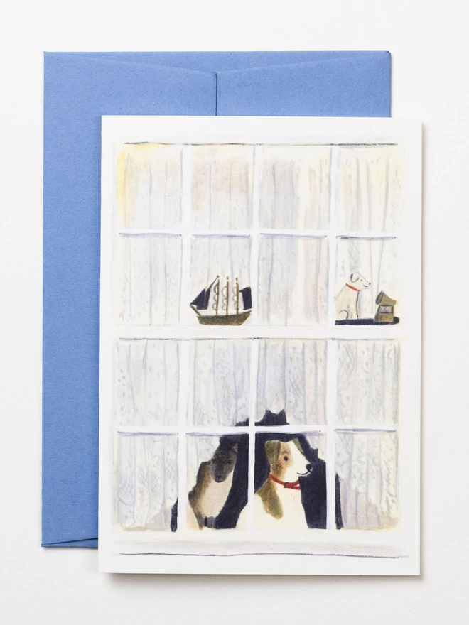 A greetings card featuring a Siamese cat and a Jack Russell peeking out from beneath some net curtains. Illustrated in pencil and gouache.