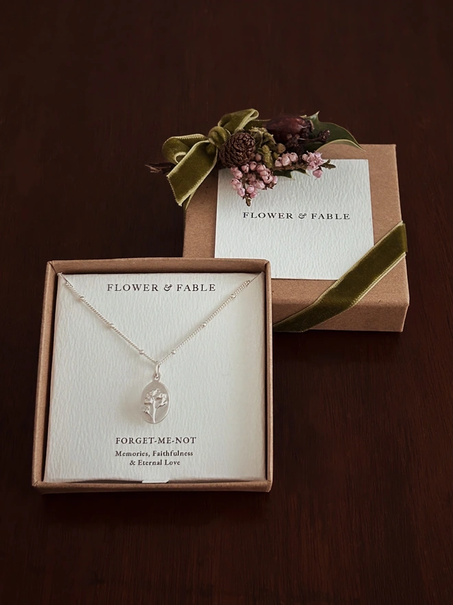 Forget me not medal on a curb satellite chain in our gift box and flower posy