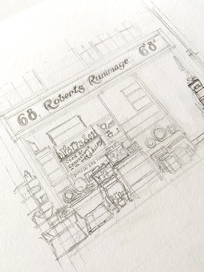 Pencil sketch work in progress of Robert’s Rummage antique shop in Hastings, a black shopfront on a yellow building, the shop window is packed and antiques and bric a brac spill out into the street infront of the shop.