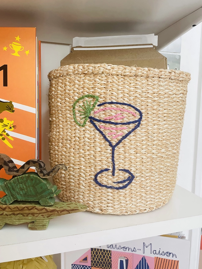 cocktail motif basket on shelf