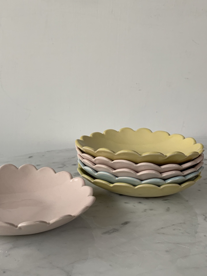 stack of camellia scallop edge ice cream bowls in yellow, pink and light blue pastel shades