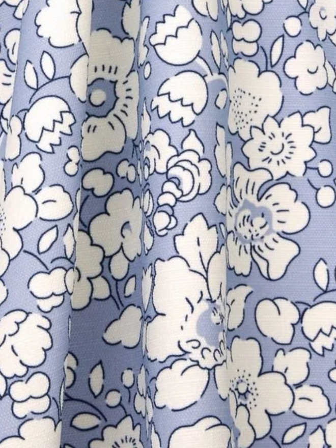 Liberty London Fringed Parasol. A parasol in lapis blue.