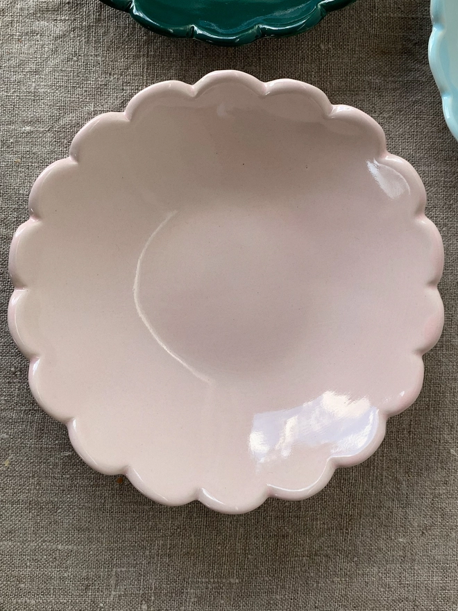 top view of camellia scallop edge ice cream bowl in blossom pink
