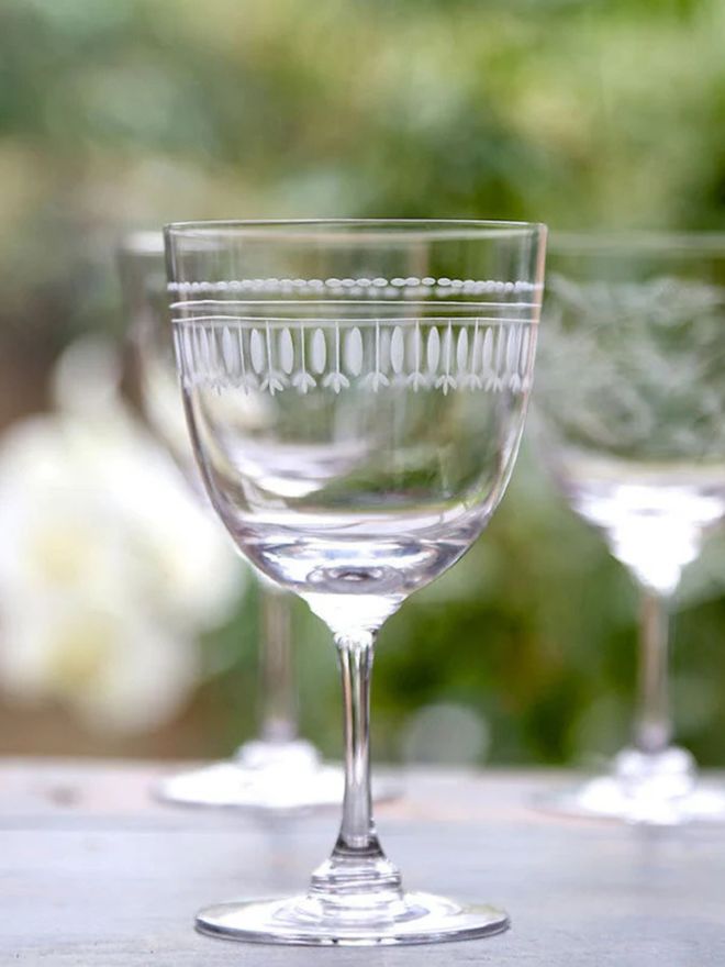 engraved oval wine glass. a wine glass with engraved oval patterning.