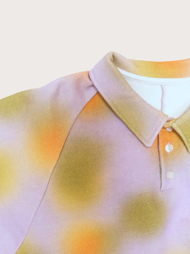 Back flat lay of the Studio Koter Luka jersey top in Hazy Lilac, showing the curved back yoke seam.