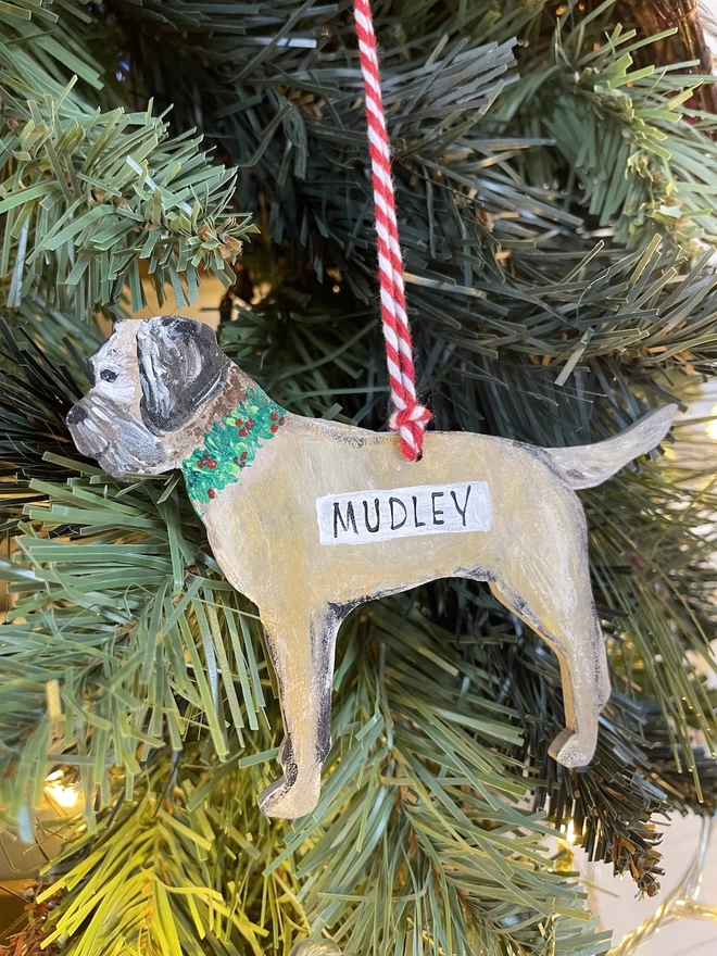 A border terrier decoration personalised with the name Mudley and hung on a Christmas tree