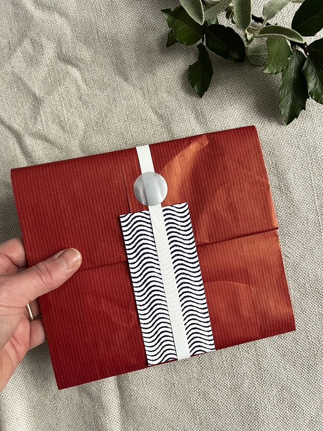 Optional Gift Wrap Comprising Red Paper, Ribbon and a printed card