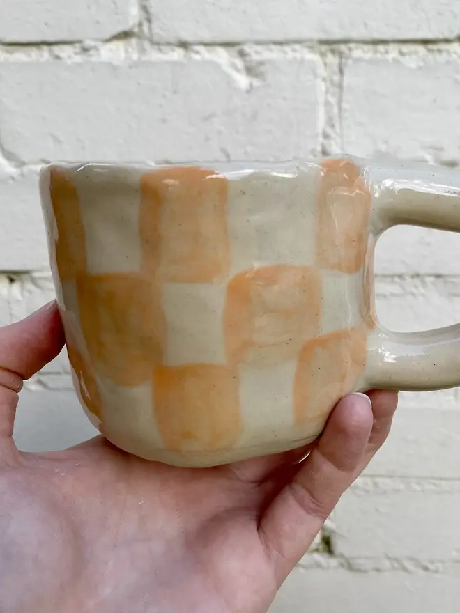 peachy checked handmade ceramic smiley face mug