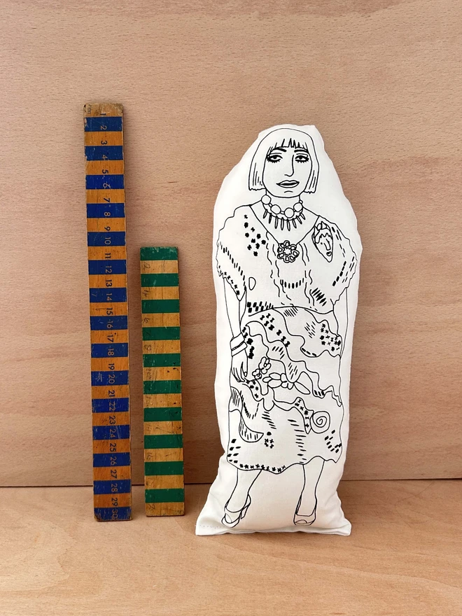 A craft kit to Sew Your Own Idol which contains a black and white fabric cushion featuring an illustration of Zandra Rhodes.