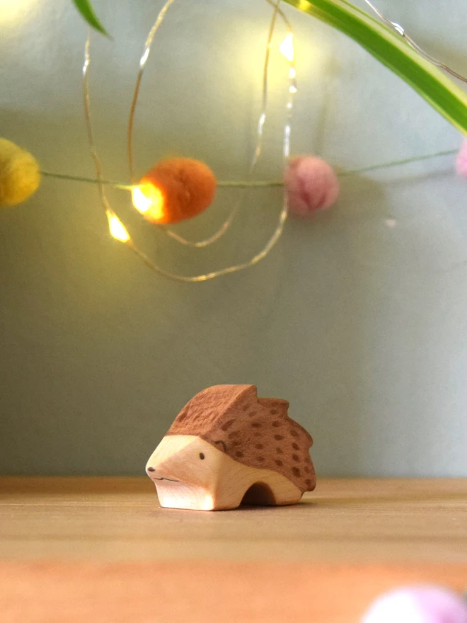 wooden toy hoglet on toy shelf