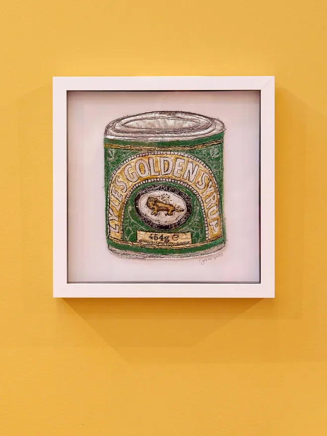 Lyle's Golgen Syrup Embroidery Wall Art with a Yellow Background