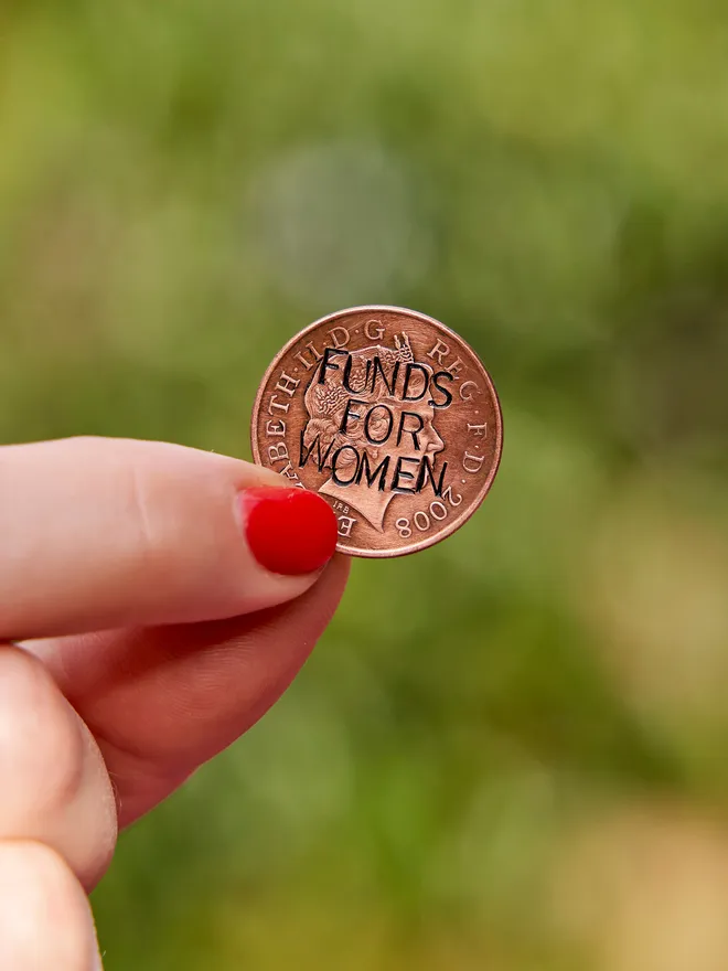 'Funds For Women' Stamped Coin