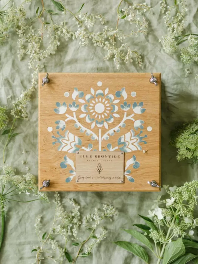 Wooden Flower Press - Scandi birds eye shot of the flower press on a green table cloth surrounded by flowers