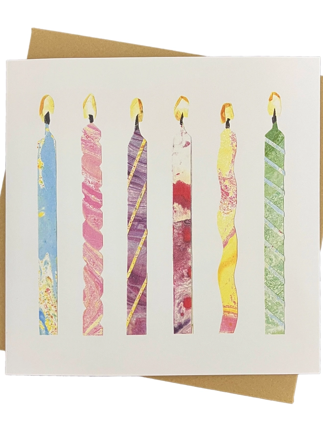 birthday card with six collaged candles on a white background