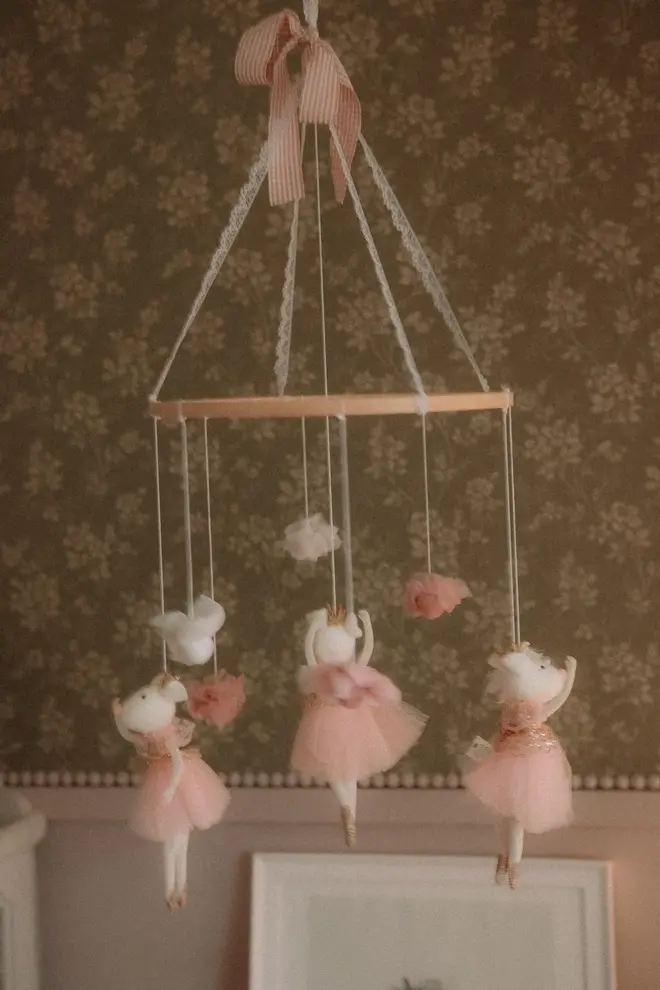 Hanging Mice Ballerina Felt Carousel Decoration, a hanging mice carousel decoration suspended in a child's decorated bedroom. 