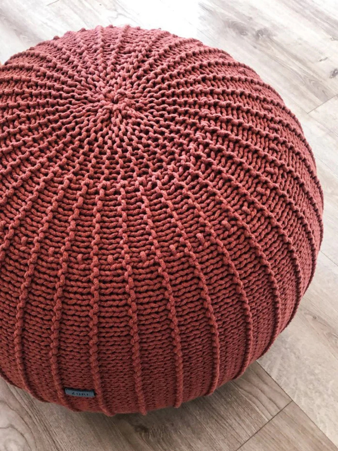 Zuri House. Large terracotta knitted pouffe.
