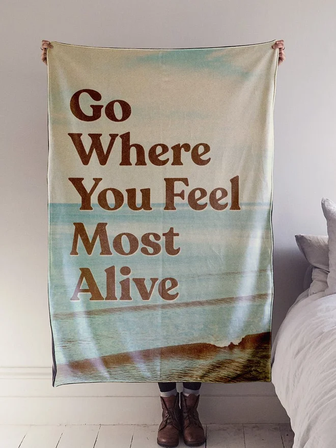 'Go where you feel most alive' Throw Blanket 