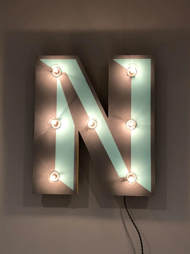 Custom letter wall light letter N in the dark