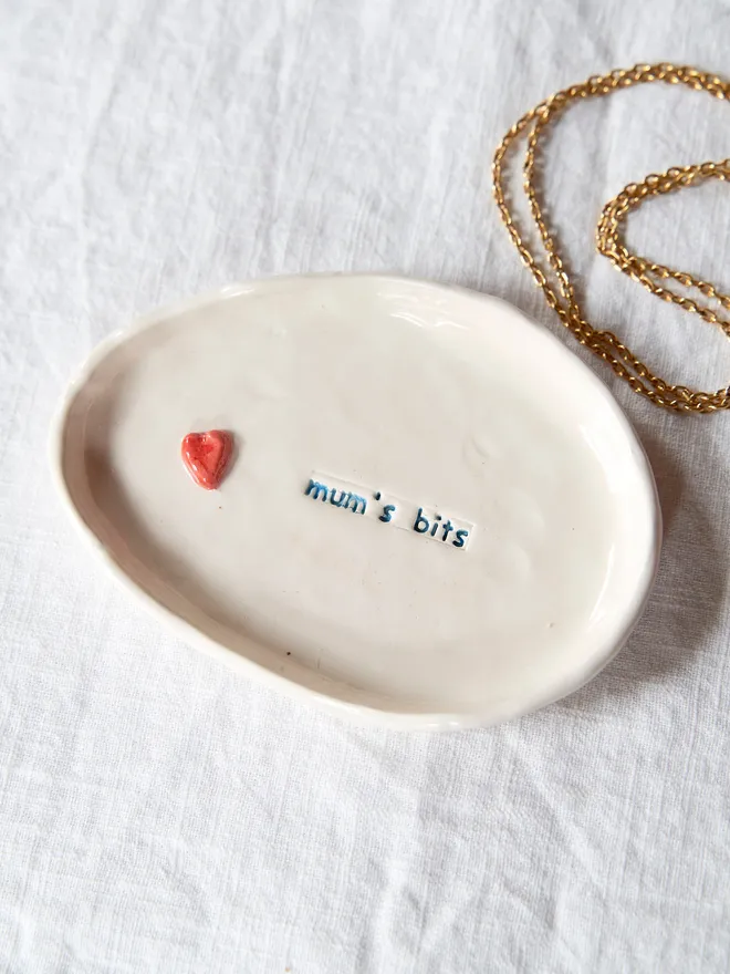 Handmade ceramic trinket dish: stamped with "mum's bits" and finished with a small red heart 