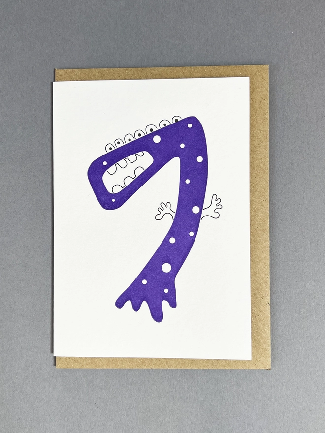 Letterpress printed neon purple number seven card with envelope for chidren's birthday