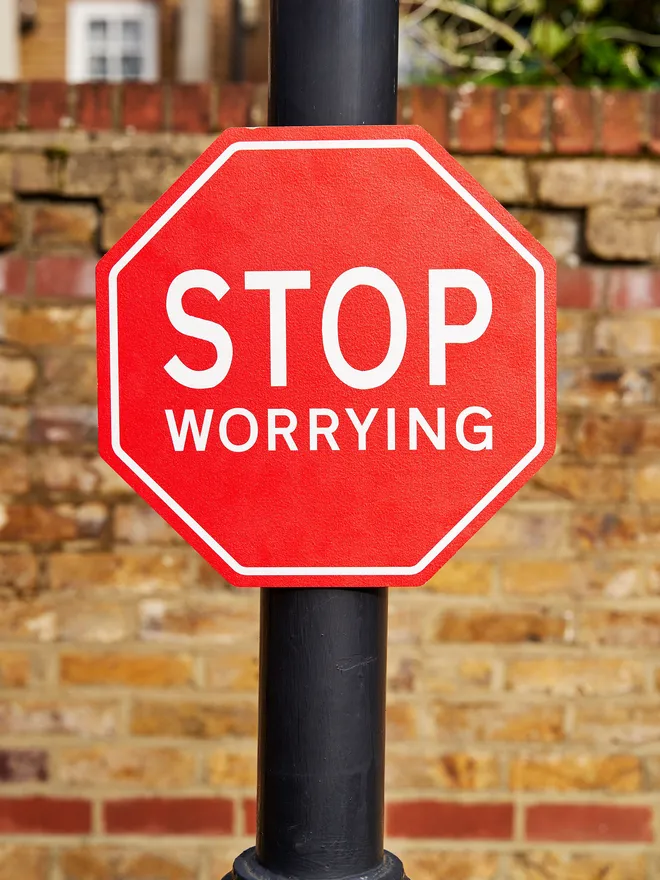 Stop worrying sign