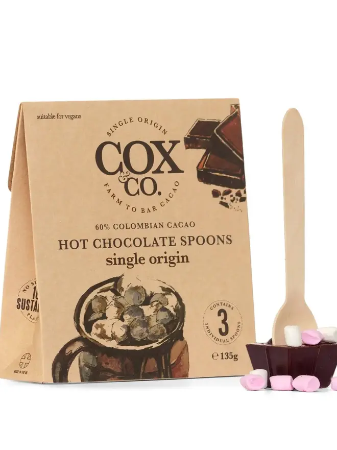 Cox&Co Hot Chocolate Spoons Single Origin (Set Of 3), a chocolate spoon sitting next to its packaging on a white surface. 