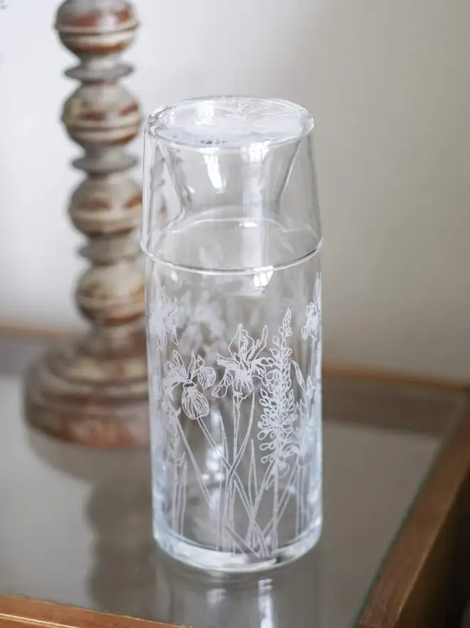 Floral Mini Carafe & Glass Set, on a clear table. 