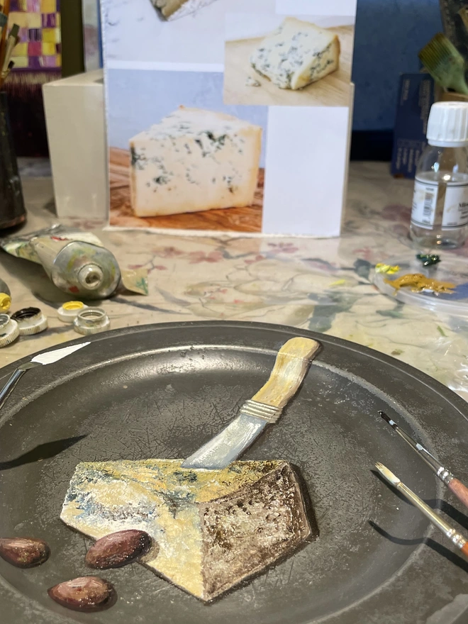 painting cheese in the studio