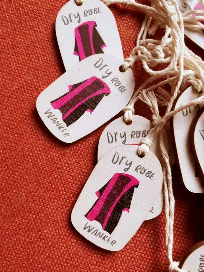 Wooden ornament reads 'dry robe wanker'