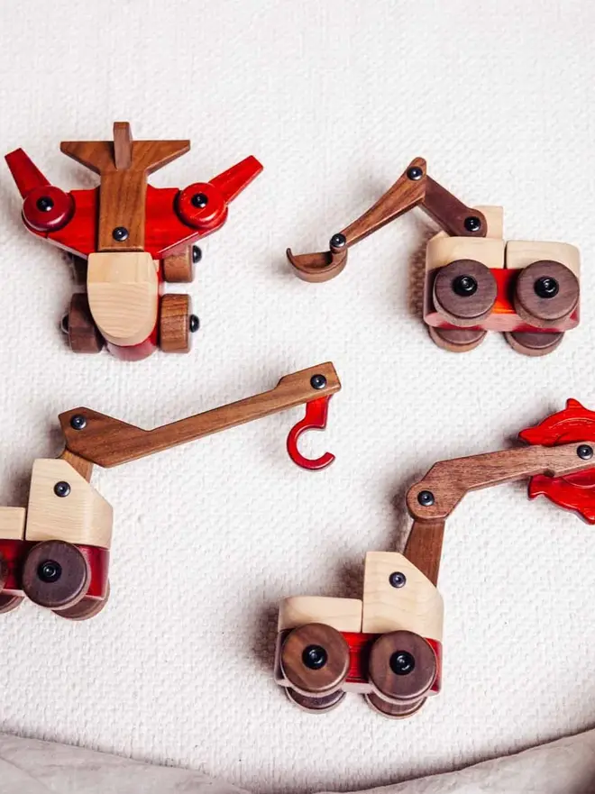 Walnut & Padauk Aeroplane Wood Heirloom Toy, on a table. 