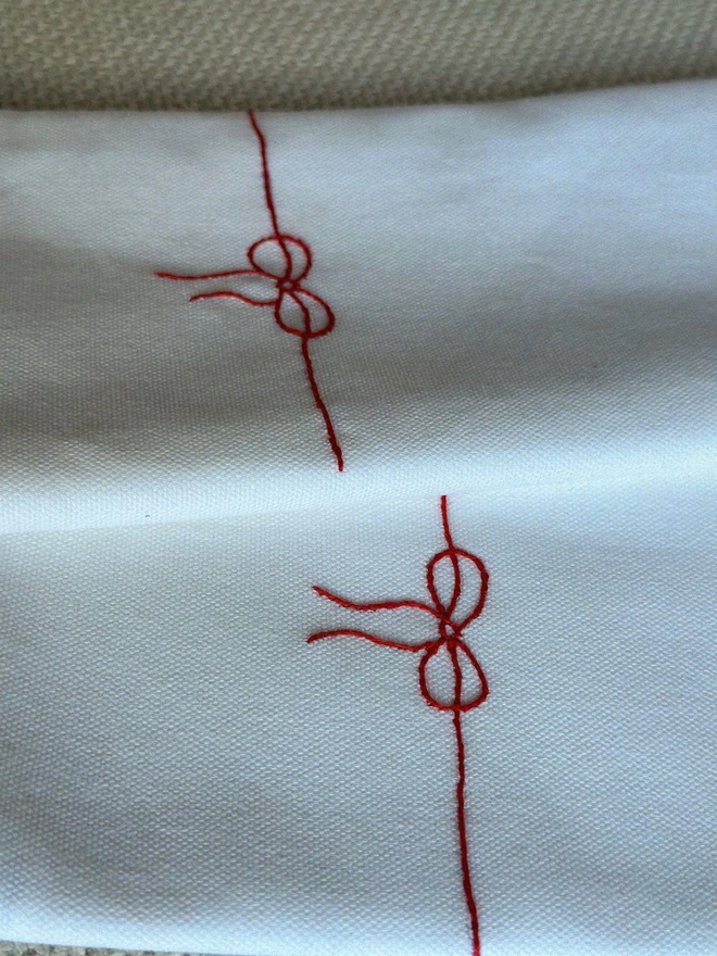 Embroidered bow napkin