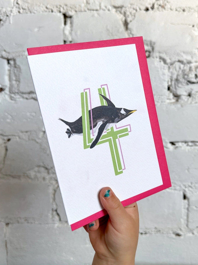 a white card with a big green number 4 and a penguin illustration with a neon pink envelope