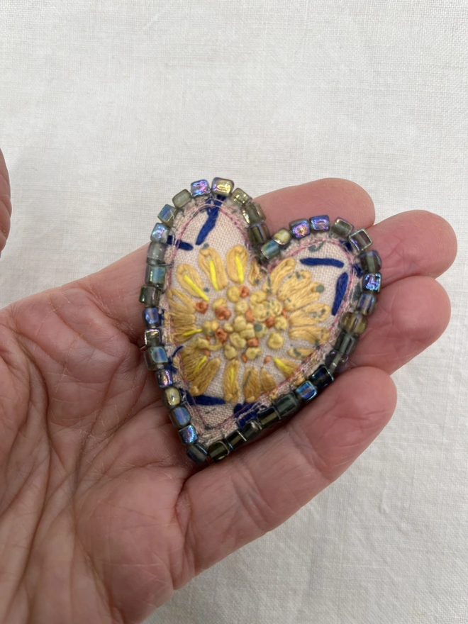 pink and yellow flower brooch