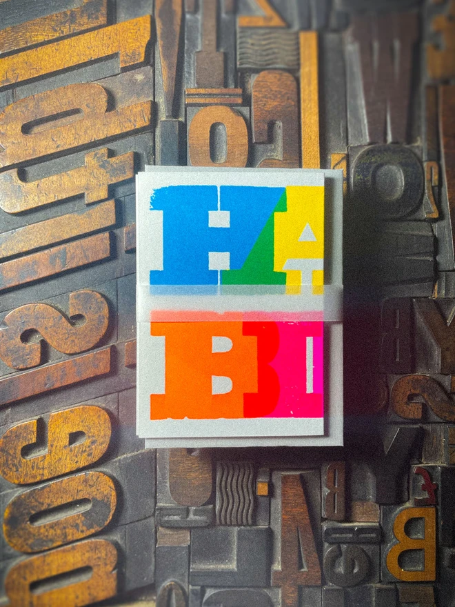 Handmade letterpress concertina birthday card featuring bold, joyful typography in vibrant neon colours. Each card is individually hand printed using traditional letterpress techniques on luxury paper stock, creating a beautifully tactile finish with deep impression and rich ink coverage. The playful fold-out concertina design reveals a striking “Happy Birthday” message across multiple panels, making it both a greeting card and a keepsake.  Created by hand for Holly & Co , this contemporary artisan birthday card combines modern graphic design with traditional craftsmanship. Perfect for design lovers, colourful stationery enthusiasts, and anyone looking for a unique luxury birthday card with personality.