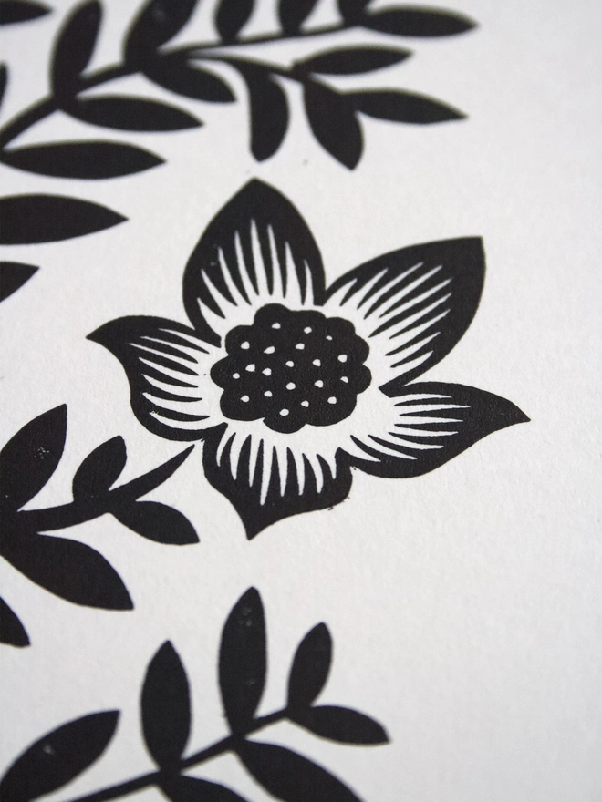 A4 Linocut print of symmetrical flower design