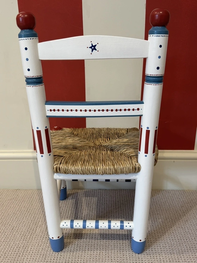 Nursery decor with a Childs chair. 