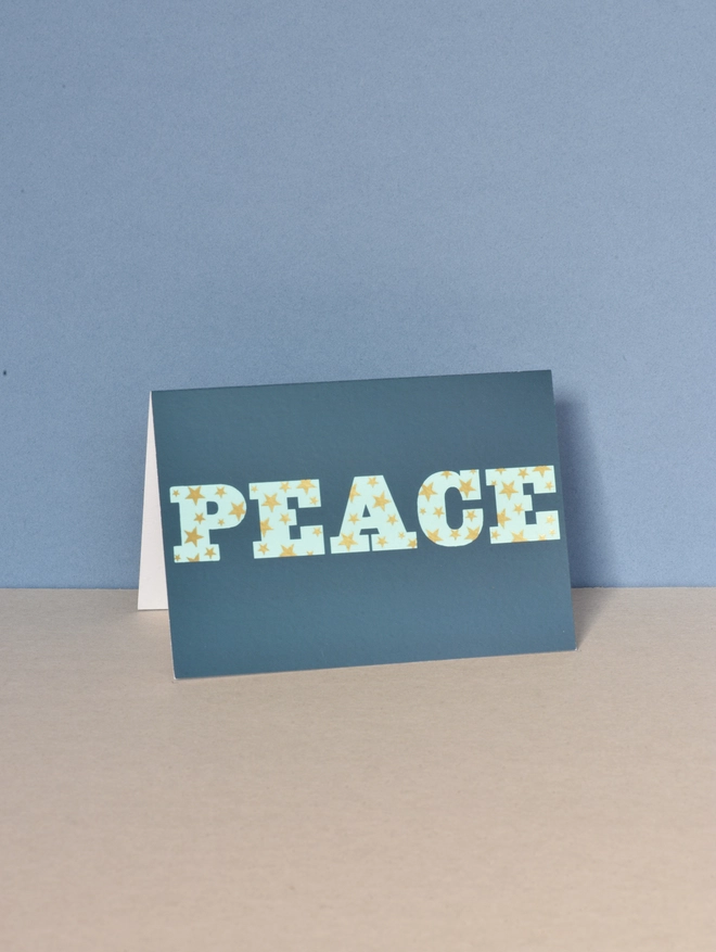 Peace with gold stars card