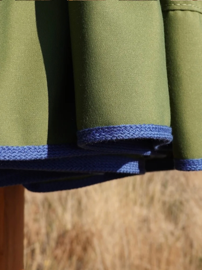 Parasol with Contrast Colour Trim. A parasol in olive green with blue trim