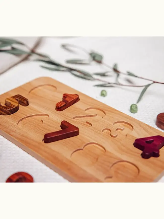 Wooden Number Puzzle Heirloom Toy, on a table. 