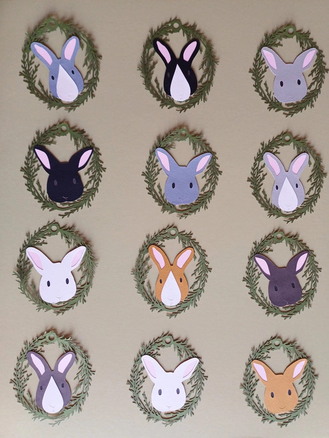 Complete set of twelve decorations, with 11 unique designs. White bunny included twice in set